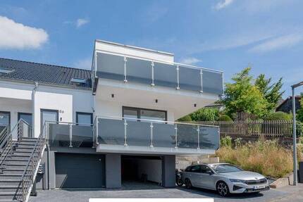 Architektur trifft Achtsamkeit: Stilvolle Etagenwohnung mit Bergblick, Terrasse & grüner Technik 3 zimmer